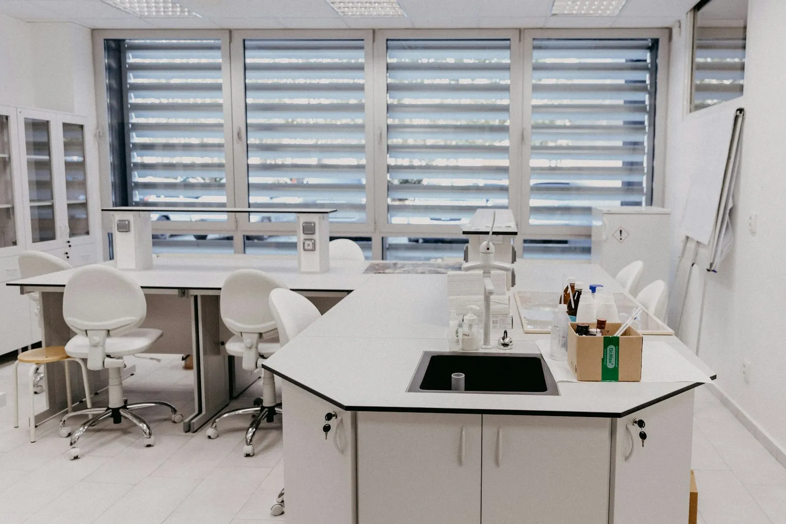 A clean, empty lab with white benches